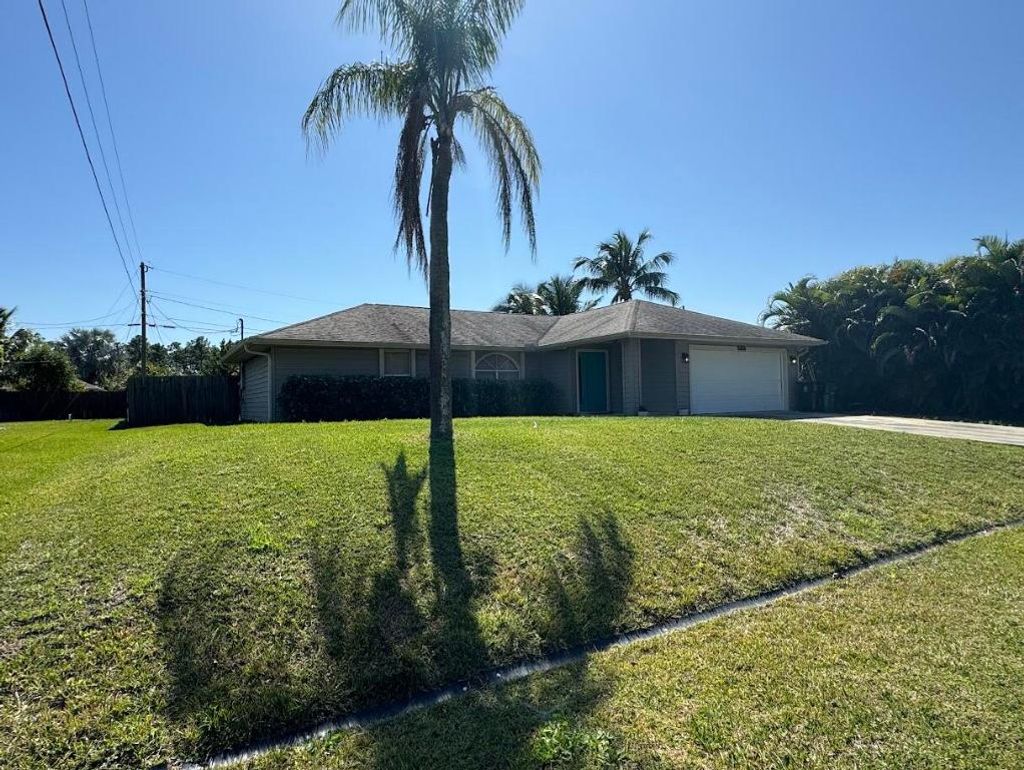 Photo of 1674 SW Whipple Avenue, Port Saint Lucie, FL 34953 (MLS # R10963725)