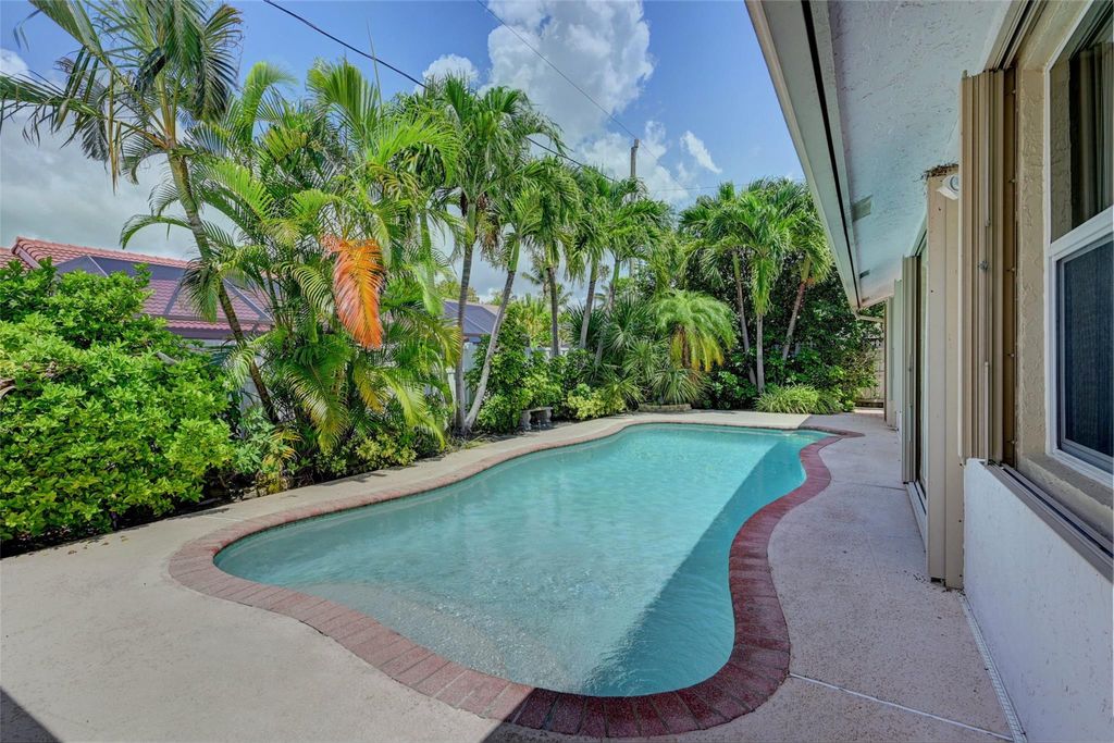 Photo of 7743 W Country Club Boulevard, Boca Raton, FL 33487 (MLS # F10494391)