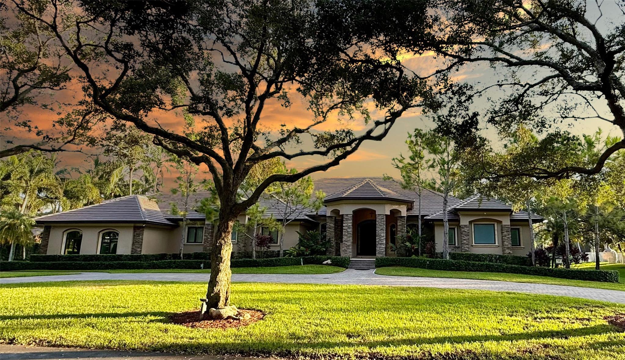 ***THE RIDGE AT LAUREL OAKS... ONE OF DAVIE’S MOST COVETED GATED COMMUNITIES!!!***
TUCKED AWAY IN A PRIVATE ENCLAVE OF JUST 18 CUSTOM HOMES, THIS HIDDEN GEM OFFERS AN EXCEPTIONAL BLEND OF LUXURY, TRANQUILITY, AND EXCLUSIVITY. SITUATED ON A PRIME BUILDER’S ACRE WITH LAKEFRONT VIEWS, TOTALING 7,603 SQFT UNDER ROOF W/5,500 SQFT OF LIVING AREA, THIS ESTATE SHOWCASES REFINED LIVING AT ITS FINEST. HIGHLIGHTS INCLUDE A BRAND-NEW FLAT TILE ROOF, FULL-IMPACT GLASS, AND AN EXPANSIVE OPEN-CONCEPT LAYOUT. THE PROPERTY IS ADORNED WITH MAJESTIC MATURE OAKS, FRUIT TREES, AND LUSH/MANICURED LANDSCAPING, CREATING A SERENE CANOPY OF PRIVACY. THE RESORT-STYLE BACKYARD FEATURES A FULL SUMMER KITCHEN, SPARKLING POOL AND JACUZZI, AND PRIVATE BEACH ON THE LAKE—A RARE AND PEACEFUL RETREAT RIGHT AT HOME.