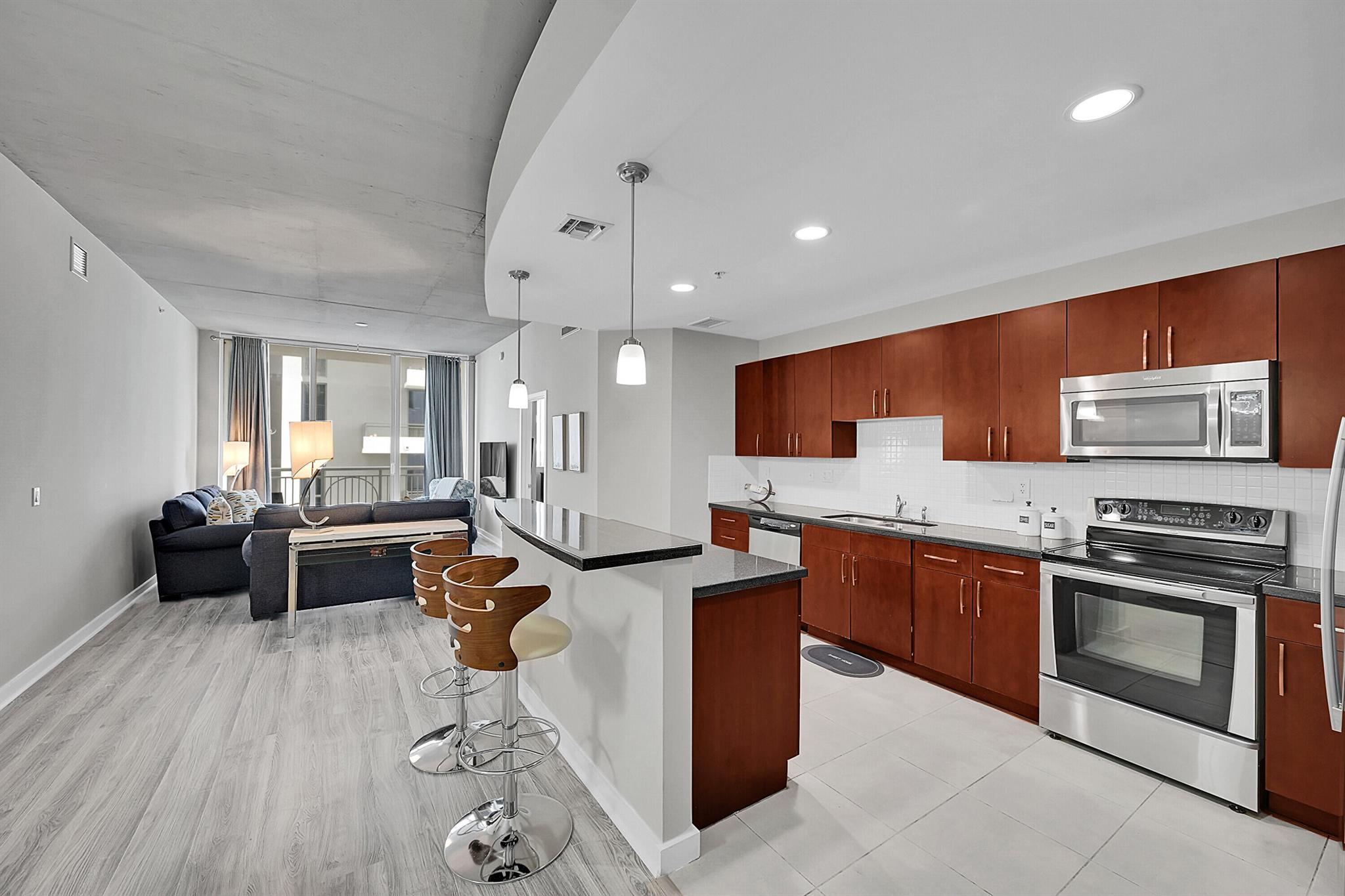 Escape to this exquisitely modern condo in Downtown West Palm Beach. This luxurious apartment boasts stunning views of the city, updated kitchen with stainless-steel appliances, granite countertops, and a spacious living area fully equipped with new furniture. Impeccable 2 bed- 2 bath unit on the 11th floor with split floor plan, two master suites open kitchen, high 12-ft. ceilings, and large windows. ''The Edge'' boasts a modern design, a 24-hour attended lobby, resort-style pool, hot tub, fitness center, and more. Wi-Fi and water are included with rental. Centrally located in downtown WPB, near Rosemary Square, and minutes to the beach.