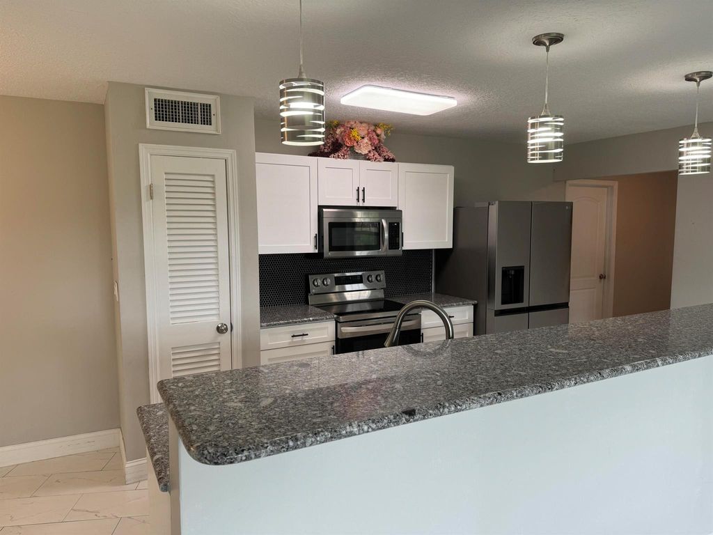 Photo of 118 NW Airoso Boulevard, Port Saint Lucie, FL 34983 (MLS # R11004316)