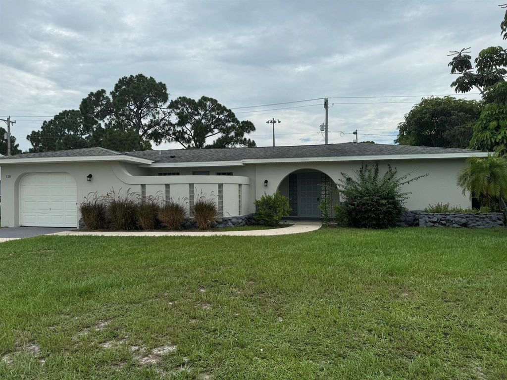 Photo of 118 NW Airoso Boulevard, Port Saint Lucie, FL 34983 (MLS # R11004316)