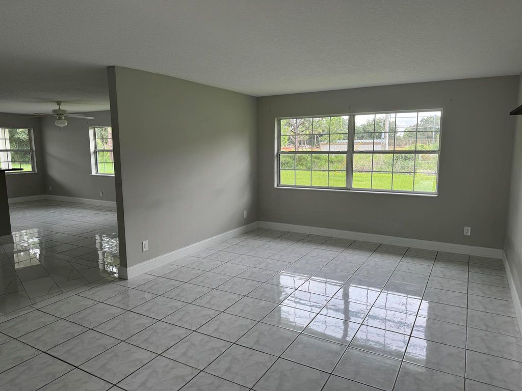 Photo of 118 NW Airoso Boulevard, Port Saint Lucie, FL 34983 (MLS # R11004316)