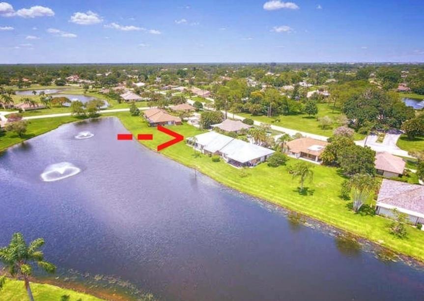 This beautifully remodeled 3/2/1 villa offers serene lake + fountain views from your spacious screened porch - complete w/ pull-down shutters for comfort + privacy. Open, airy floor plan featuring new wood-look vinyl floors, vaulted ceilings, kitchen w/ granite counters, a cook island + sleek stainless-steel appliances. The master suite boasts sliding barn doors + walk-in closet, includes a newer A/C, water heater + washer/dryer. Community offers 2 Fazio-designed championship golf courses, 24/7 manned gated & ''The Pointe'' clubhouse w/ resort-style pool, dining, gyms, tennis.