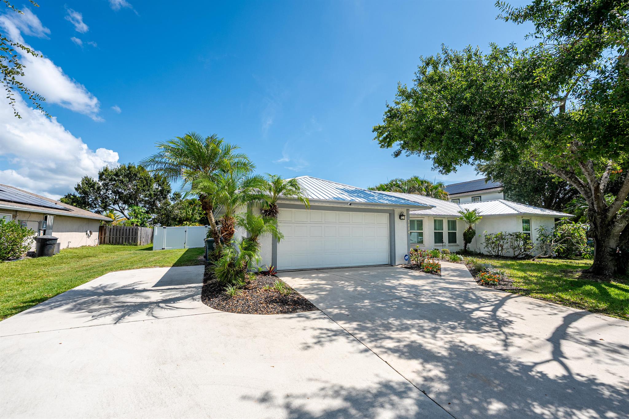 You will love this immaculate 3BR/2BA pool home in White City! Enjoy a lush tropical setting close to I-95, Turnpike & US-1. Split floorplan, tile throughout, coastal design, with plantation shutters, New 2023 Metal Roof, screened in 1,300 SF patio with heated saltwater pool, newer pool pump/filter, water heater, & appliances. Granite kitchen, stainless LG appliances, whole-house water filtration & RO. Smart ADT security, Google Nest Thermostat & Google Devices. Covered brick paver patio. Poolside loungers (cushions in shed), outdoor lighting, & pool shed convey. All other outdoor furnishings do not convey but negotiable. Smart TV in Family room, & 2023 washer/dryer do not convey but, negotiable. Relax in the backyard; true privacy & tropical vibe with fruit trees & tropical vegetation.