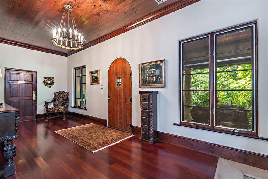 The Flagler House is a tropical waterfront oasis located in West Palm Beach on over an acre. This property encompasses exquisitely manicured grounds with a sprawling 100-ft of frontage on the Intracoastal waterway. The primary residence has 5 bedrooms, 4 full and 3 half bathrooms, a grand family and dining room with fireplace, pub/game room, and outdoor loggias. Two guest cottages (3BR/1BA and 1BR/1BA). Perfect for entertaining with an expansive backyard, pool, 70-ft dock, and nearby Rybovich Marina.