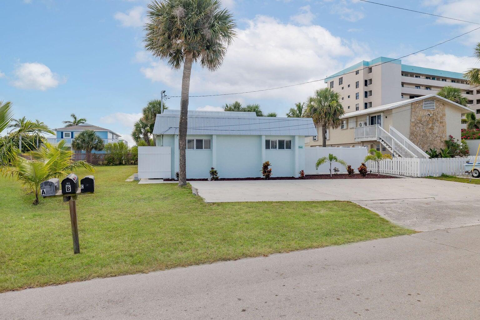 Tastefully coastally furnished 3-bedroom ground-floor unit in a quiet, non-association triplex on gorgeous Hutchinson Island. This rare find offers 3 spacious bedrooms, a full bathroom, and a laundry room with washer/dryer. Enjoy the private fenced entry patio, then step through sliding doors to a rear open patio featuring cozy outdoor furniture, a gas grill, and a fireplace--perfect for entertaining or relaxing. Walk across the street to the beach or stroll to Hutchinson Island's many restaurants, shops, and attractions. With its ideal location, privacy, and charm, this home offers a true island lifestyle. Call today to schedule a tour!