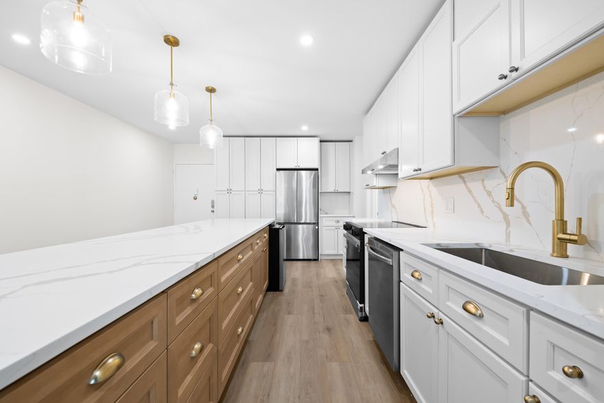 One-of-a-kind unit fully renovated turnkey converted to   2 bed / 2 bath layout with no expense spared. No other property has been redesigned to match this incredible floorplan. Features include luxury vinyl flooring, porcelain tile in bathrooms, shaker doors, and a modern wood kitchen with soft-close cabinetry. Quartz countertops with waterfall edges and full backsplash, stainless steel appliances and elegant pendant lights over the island complete this exceptional home. Second  bedroom has custome blue tiles throughout with large tub. Unit comes with in unit washer /dryer, Impact windows and doors throughout. Recessed lighting throughoutBuilding has gym, pool, 24 hr security, private beach access, community room & more! Walking distance to restaurant, pharmacy, grocery stores and more!