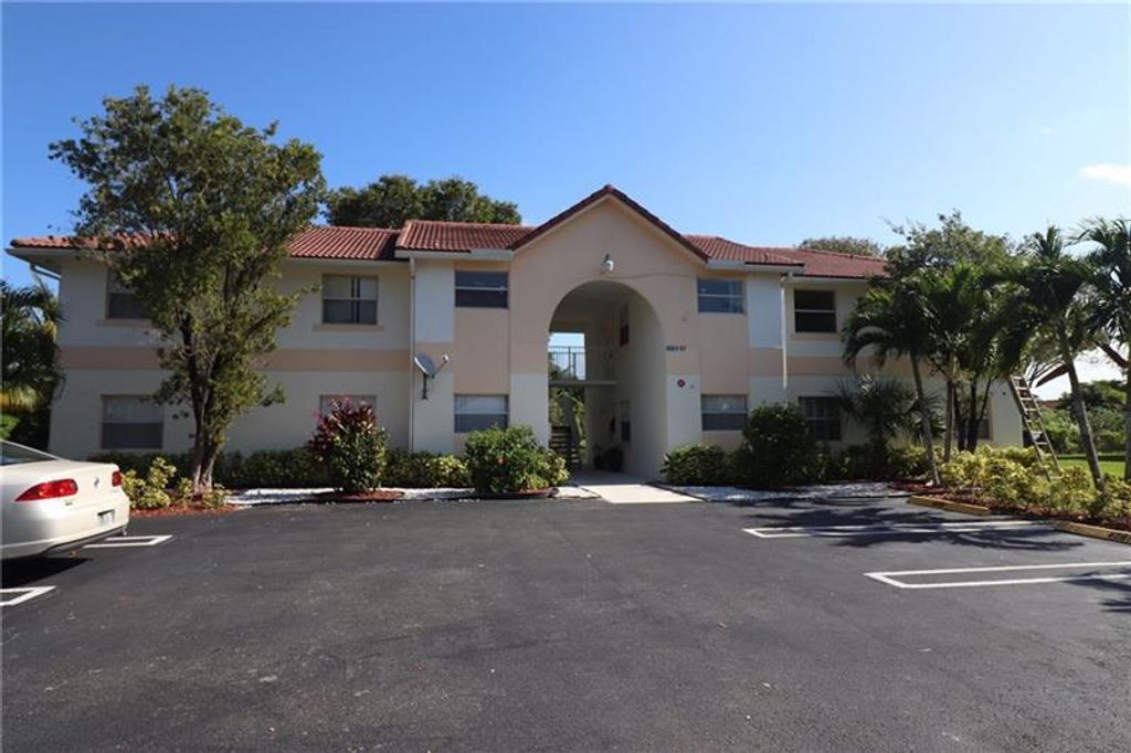 Photo of 4065 NW 114th Avenue, Coral Springs, FL 33065 (MLS # B26021197)