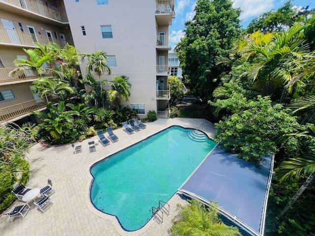 Discover your Miami oasis! This stunning 1-bed, 1.5-bath corner unit in Bay Harbor Islands offers the perfect blend of luxury and location. Enjoy impact windows, granite counters, S/S appliances, custom walk-in closet, an area for an office and sleek tile floors throughout. Your home boasts a newer A/C, a washer/dryer, and you're just steps away from the refreshing community pool. Wake up to serene views of the city's recreational park and take advantage of endless outdoor activities. Includes one dedicated parking spot and additional storage. You're just blocks from world-class shopping at Bal Harbour Shops and the beach, with top-rated dining in Surfside. Located in an A-rated school district and a short drive to two major airports, this is truly Miami living at its best!