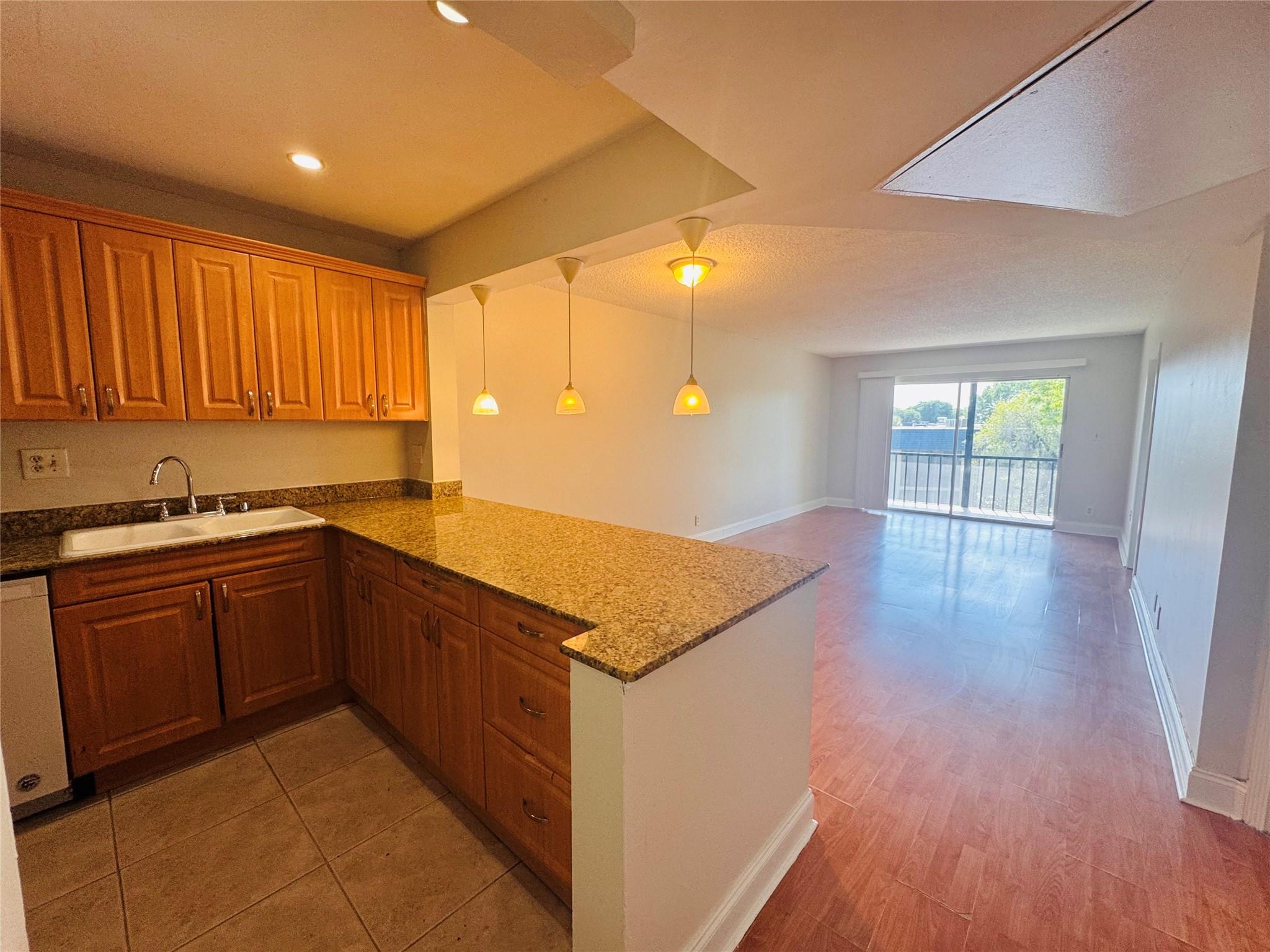 Move-in ready 2-bedroom, 2-bath condo in a spacious layout perfect for a family! Located in a secure gated community, fresh paint, stainless steel and white appliances, washer and dryer inside the property. Enjoy stunning lake views. Community amenities include a pool, tennis court, and more. Excellent location—just 10 minutes from Sawgrass Mall, top restaurants, and major highways. Requirements: No pets allowed. Association requires a minimum credit score of 625.
