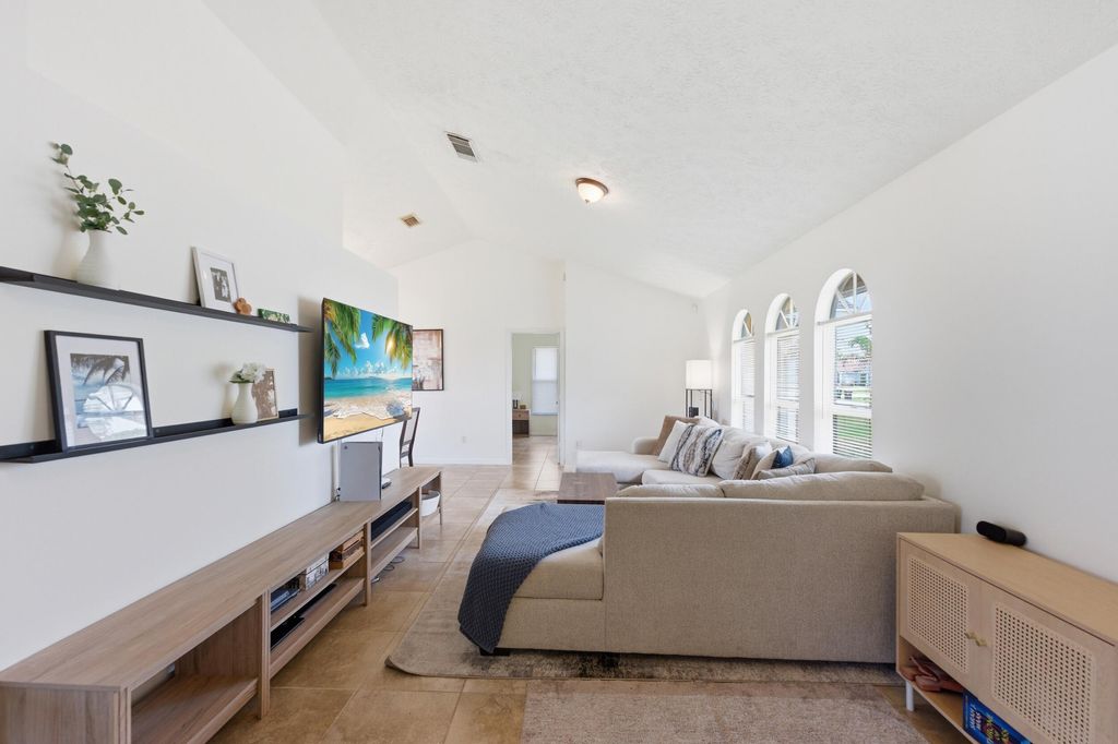 Photo of 390 SE Cork Road, Port Saint Lucie, FL 34984 (MLS # B26022908)