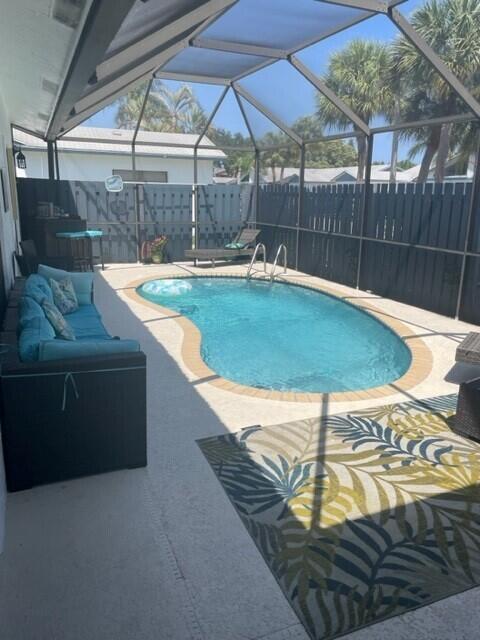 Offered Furnished or Unfurnished; beautiful and pristine 3 bedroom villa with private, screened-in pool is truly move-in ready. Freshly painted and modern, all 3 bedrooms have sliders that open to the pool deck. A true Florida oasis. Primary bedroom has vaulted ceilings and tons of natural light. White kitchen and bathrooms. Avail July 1st 2023