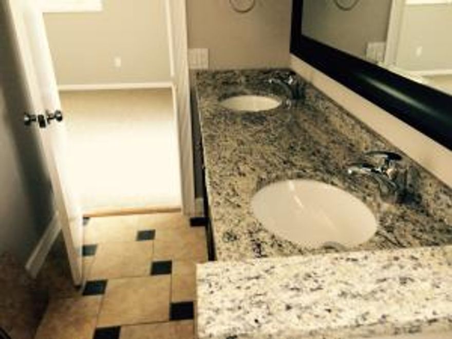 Fully Renovated Spacious townhouse with new tile new carpet, granite and stainless kitchen.
