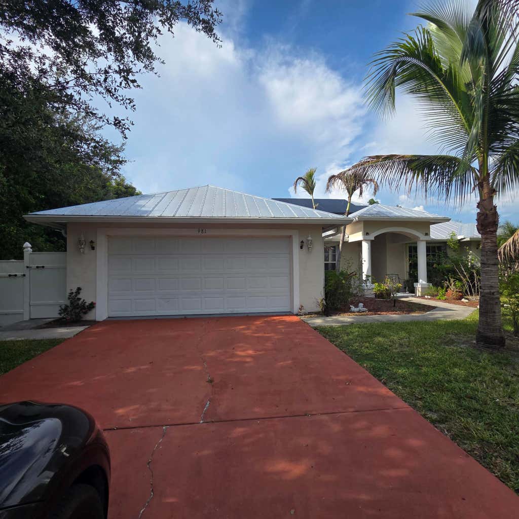Photo of 981 SW McCracken Avenue, Port Saint Lucie, FL 34953 (MLS # B26068509)