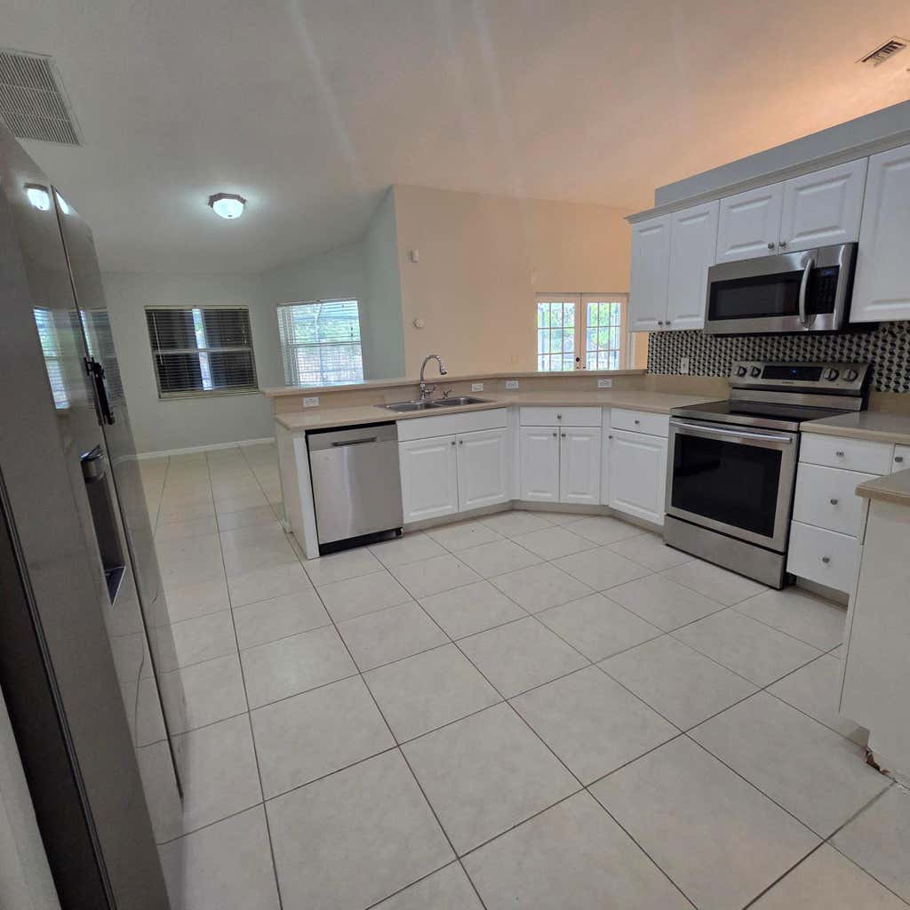 Photo of 981 SW McCracken Avenue, Port Saint Lucie, FL 34953 (MLS # B26068509)