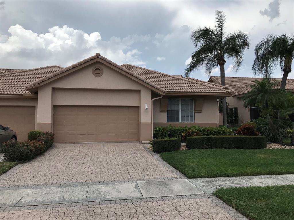 This is a well-cared for spacious villa w/ 2 BRs + a Den; updated kitchen w/ granite counter tops, stainless appliances, pantry & breakfast area & a beautiful view of the lake from most rooms and the lanai. Villa is located in a pristine & perfect spot to spend glorious FL winters while your friends & family freeze in the cold! W/D