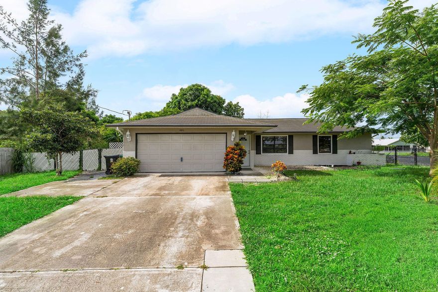 Welcome to your dream home in Port St. Lucie! This beautifully updated home, with renovated kitchen and bathrooms, lots of windows for views of the huge backyard. Located just minutes from I-95 /Turnpike, and all of your favorite shopping spots, this is the flexible Florida lifestyle you've been looking for! Sellers are very motivated bring your best offer forward. Sellers are willing to contribute $5,000 towards buyers closing cost with a full price offer.