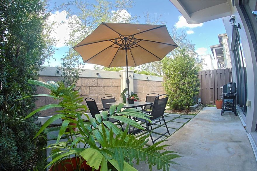 Beautiful corner townhouse located in the desirable Doral Cay community. This spacious residence offers 4 bedrooms and 3.5 bathrooms, situated on a premium corner lot. The open-concept kitchen features stainless steel appliances and flows seamlessly into the main living areas. The outdoor space offers a spacious rear porch terrace, ideal for relaxing or entertaining.Additional features include a 2-car garage, a 3-year-old A/C system, and brand-new washer and dryer (2026).The gated community offers low HOA fees, including high-speed internet and Wi-Fi, along with amenities such as a resort-style pool, sauna, fitness center, and BBQ/party areas. Conveniently located near top-rated schools, universities, shopping, and dining.