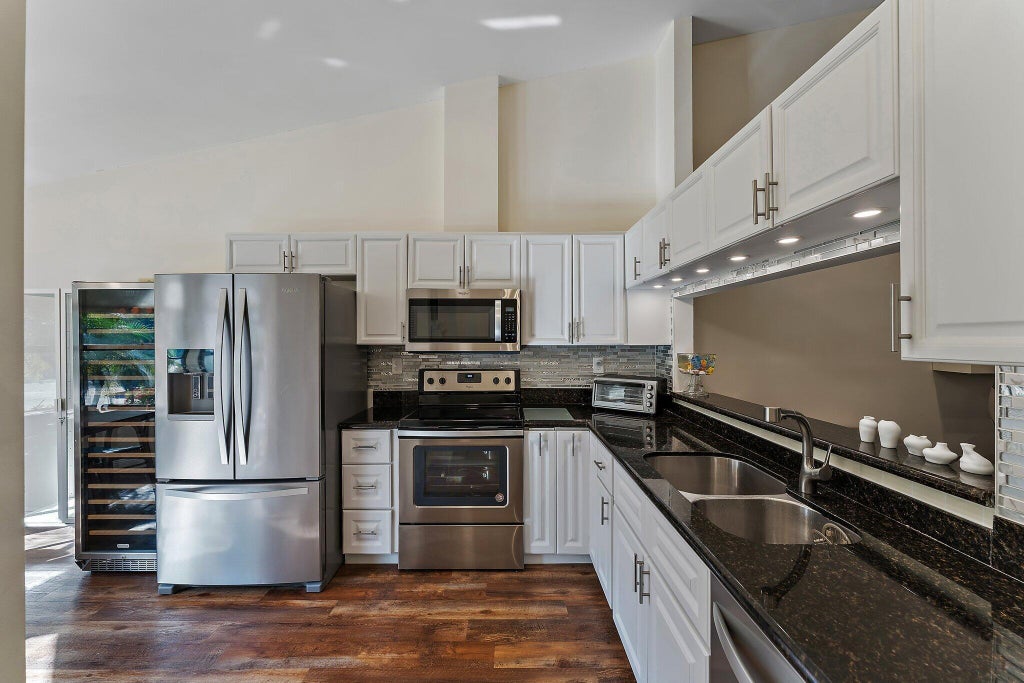 Photo of 801 Kintyre Court, Palm Beach Gardens, FL 33418 (MLS # B26072424)
