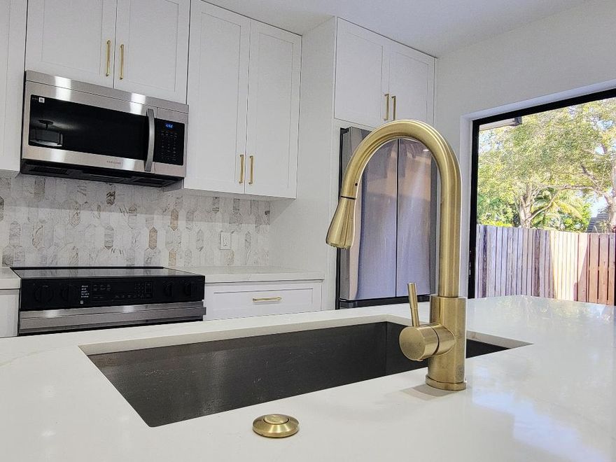 If you're looking for a townhome with everything new, this is the one! New fixtures, flooring , cabinetry, trim and more.  This newly renovated townhome will not disappoint! All new 3/4'' solid kitchen cabinets and vanities with quartz and Calcutta tops. Flooring in main areas is 100% waterproof with a 40 year warranty. The master bath is outfitted with double sinks and a frameless shower enclosure with modern fixtures. Call Glenn for a showing ...this won't last!