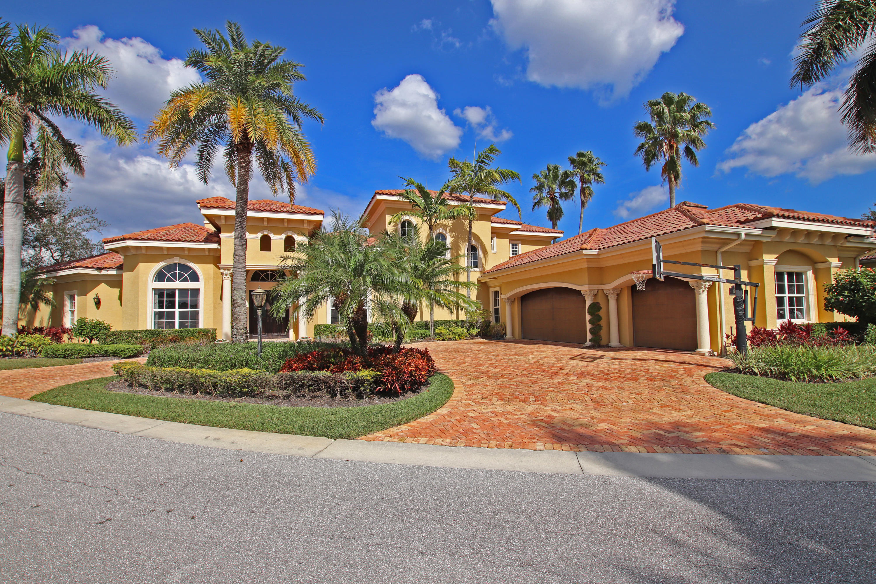 Spectacular riverfront custom home with resort-style pool/spa, summer kitchen, 2 docks and a total of 283+/- ft. of water frontage (approximately 200 ft. on the river & 83 ft. along the front of the home). Additional features include game room with wet bar, gourmet kitchen, master bedroom with great water views, exercise room, an ideal area for in-law or nanny quarters, 3-car garage, brick driveway, impact glass and private patio. Water surrounds the house in front & back.