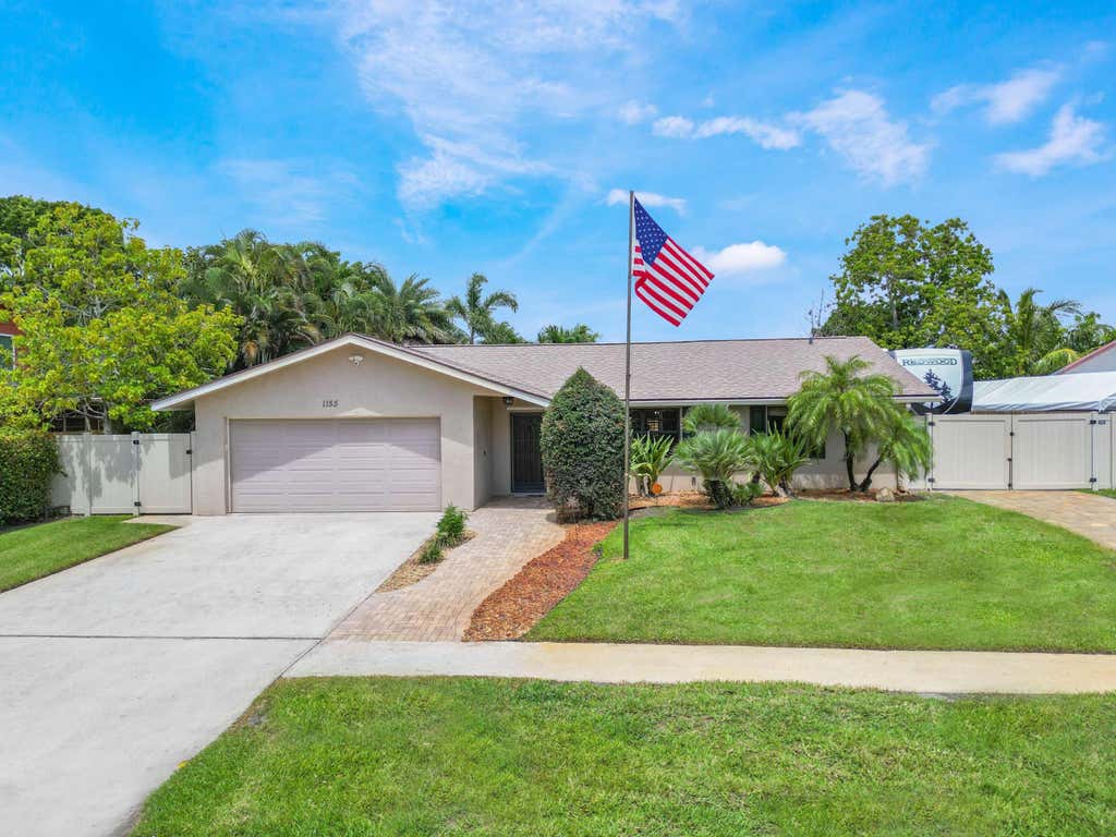 Photo of 1155 Woodcrest Road W, West Palm Beach, FL 33417 (MLS # R11101665)