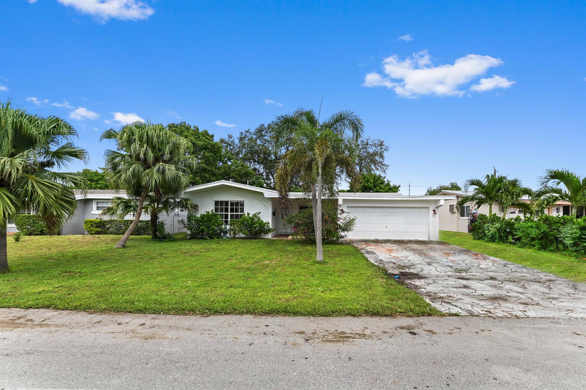 Motivated seller ! Submit all offers! Discover the perfect Florida lifestyle in this well maintained 3-bedroom, 2-bath pool home, ideally located in the sought-after Miramar Isles community with no HOA! This residence offers a fantastic layout designed for both comfort and privacy. The main living areas and kitchen feature tile flooring, while the bedrooms provide warmth and charm with laminate wood floors. The kitchen is a true centerpiece, boasting classic wood cabinets, granite countertops, and a stylish tiled backsplash, making it a delightful space for entertaining and everyday living.