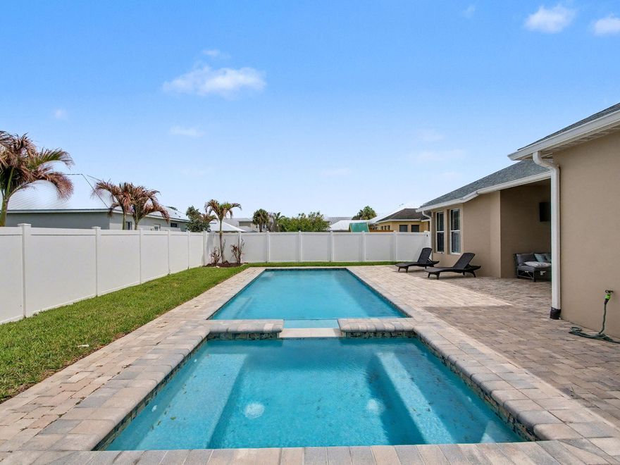 Welcome to this beautifully updated 4-bedroom, 2-bathroom pool home located in the highly sought-after Bedford Park at Tradition. Blending comfort, style, and functionality, this home features a spacious open floor plan and a fully remodeled kitchen with modern finishes, ample cabinetry, and generous counter space, all seamlessly connecting the main living and dining areas. Recent upgrades include a 2022 roof, newer water heater, and partial impact windows at the front of the home, offering added peace of mind and efficiency. Step outside to your private backyard oasis, complete with a heated saltwater pool featuring a sundeck and built-in spa, all within a fully fenced yard—perfect for relaxing or entertaining year-round. This exceptional outdoor space enhances the home's lifestyle appeal Enjoy a low-maintenance lifestyle with Bedford Park HOA services that include lawn care, pest control, sprinkler system maintenance, common area upkeep, cable, high-speed internet, landline phone, and alarm system monitoring.  Ideally located in the heart of Tradition, you're just minutes from Town Center shopping and dining, community parks, walking trails, and year-round events. This move-in ready home offers the perfect combination of upgrades, amenities, and location!