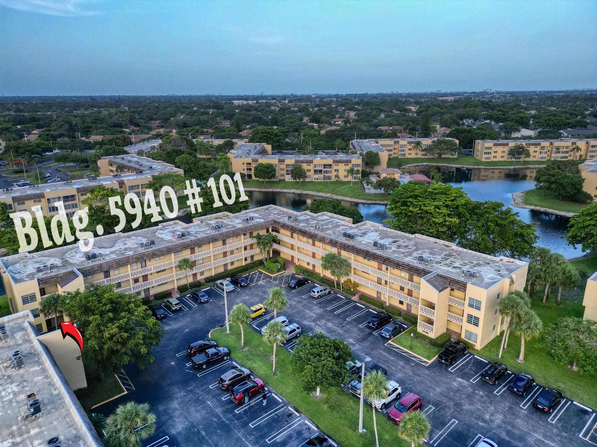 Updated 2-bedroom, 2-bath corner condo in the desirable 55+ community of Bermuda Club. This first-floor end unit offers added privacy, extra windows that fill the space with natural light, and relaxing views of the pool and surrounding lakes. It features wood flooring throughout, a newly remodeled primary bathroom, and a modernized kitchen with new appliances and a cozy breakfast nook. With your assigned parking spot located just outside the door, convenience is built in. The community offers a clubhouse, pools, fitness center, shuffleboard, and more.