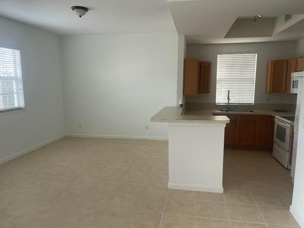 Photo of 10440 SW Stephanie Way #211, Port Saint Lucie, FL 34953 (MLS # R11154895)