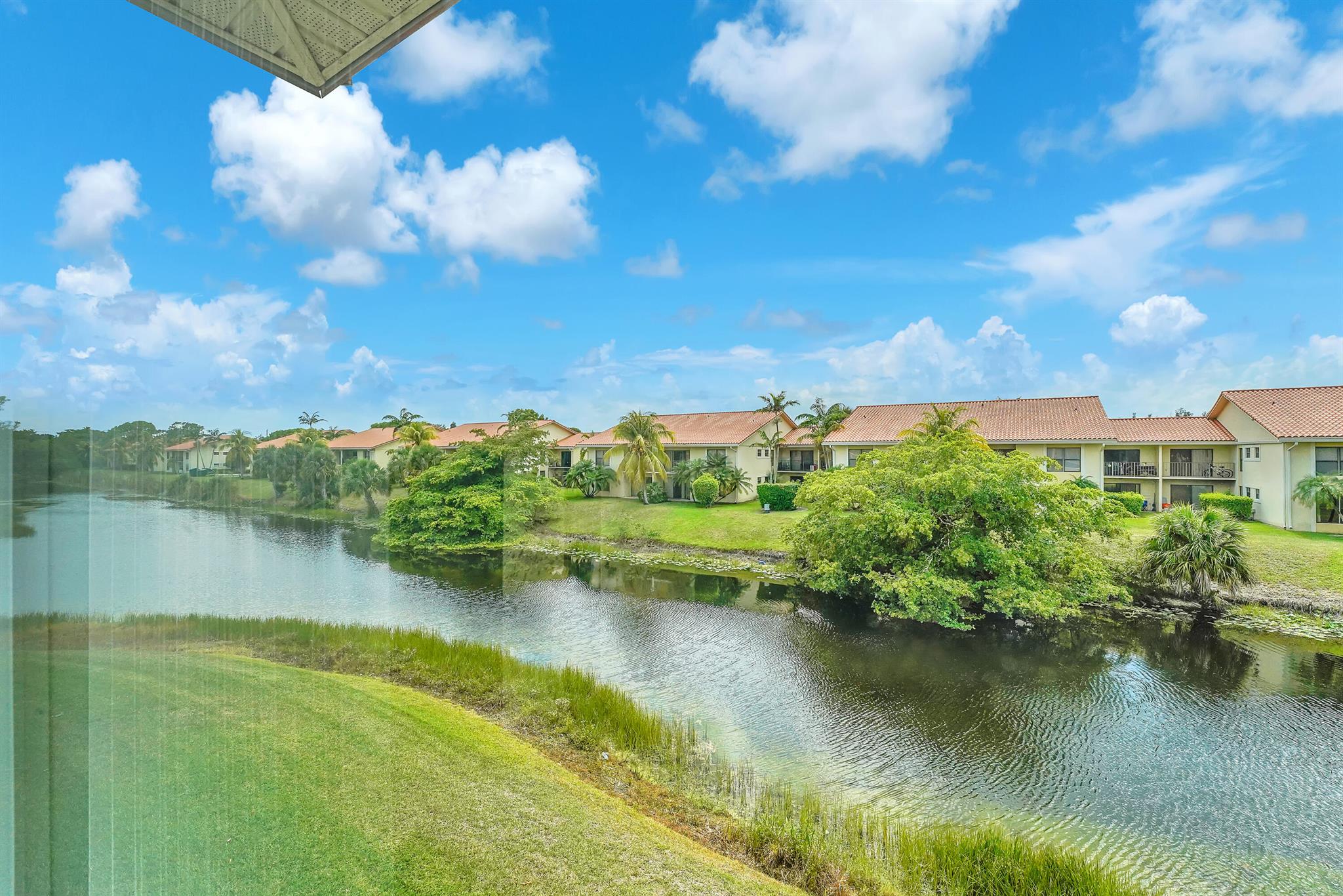 Attention SNOWBIRDS, escape to sunny Florida and enjoy this charming 2-bedroom, 2-bath waterfront condo on the 2nd floor (walk-up) complete with an enclosed Florida Room--perfect for relaxing with a view. Step inside to find an updated beautifully decorated unit with spacious walk-in closets in both bedrooms. A true bonus: in-unit laundry with full-size washer and dryer for your convenience! This vibrant 55+ community offers resort-style amenities, a courtesy shuttle bus, with a calendar full of activities to keep you engaged. Ideally located near shopping, dining, beaches, entertainment, I-95, the Florida Turnpike and PBI airport. All utilities are included in the rental price--electric, water, cable, and WiFi. Don't miss this move-in-ready opportunity to enjoy the Florida lifestyle!