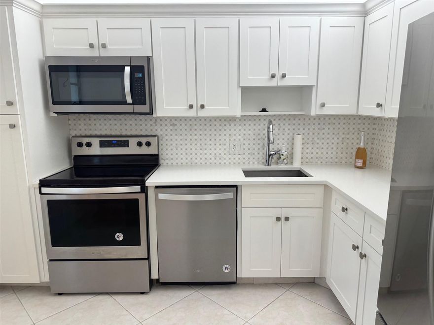 This beautiful 1 bedroom 1 1/2 bath ground floor unit is in the quiet golf community of Palm Aire. Tile floors, stainless steel appliances, new a/c and thermostat (2023), roller shades, custom wall racks w/ shelving in the walk in closet. Bathrooms have been tastefully remodeled. Cable & Internet included.  There is an incredible lake view from screened patio with a walking path for exercising. Quick and easy access to 1 of 3 pools (right next to this building.)  Parking lot recently paved. Close to Casino, dept stores, fast food & take out restaurants. Area offers amenities for relaxation. Pool area has been recently remodeled with a sauna in each bathroom.  For financing, you must have 20% down and 650 credit score. Owner offering credit toward closing cost to buyer. Owner is motivated to sell.