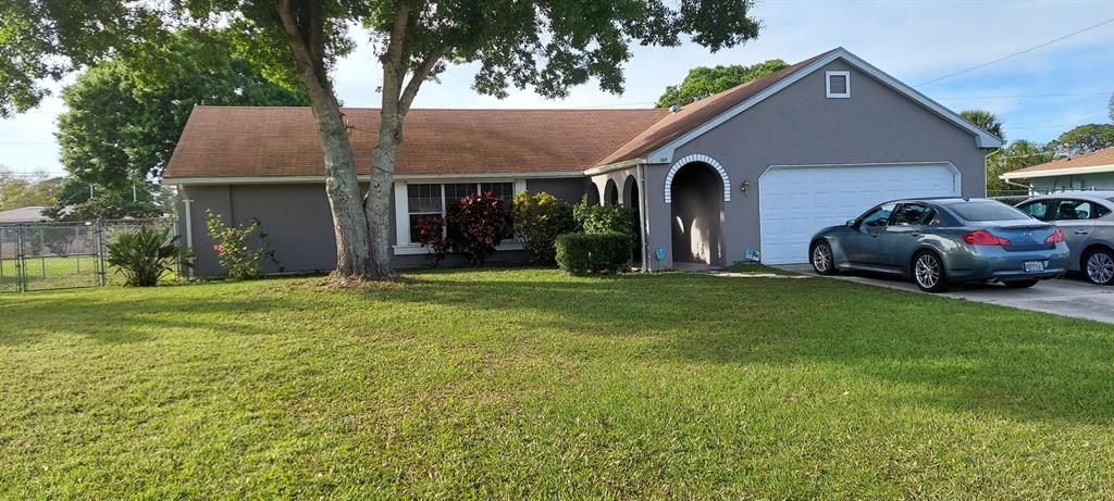 Photo of 369 SE Gasparilla Avenue, Port Saint Lucie, FL 34983 (MLS # R10697657)