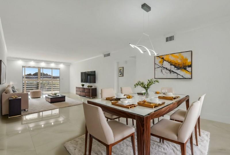 Price Reduced! Stunning Corner Unit in Wynmoor! ALL appliances are NEW. NO Assessments/40 Yr Done. Experience luxurious living in this elegantly redesigned and remodeled condo. The kitchen features a gorgeous backsplash, modern appliances, and lots of cabinet space. Both bathrooms are completely redone, and the unit offers a spacious and bright living area with an open floor plan. Enjoy new tile floors, custom-designed ceilings, retractable fans, and modern lighting. Sit back to serene pool views from your enclosed patio. The primary bedroom features a large walk-in closet and en-suite bath for added convenience. You'll have access to fantastic amenities, including onsite golf, pickleball, tennis, a fitness center, tons of clubs, movies, and live theater shows. For seasonal or year-round!