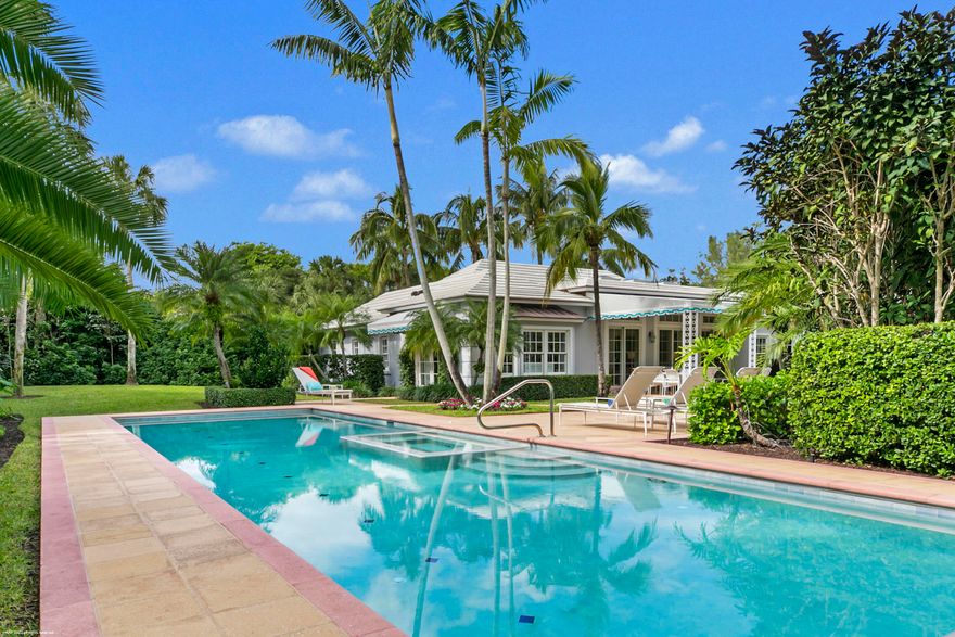 Nestled within a lush setting, just a short walk to beautiful beaches, this impeccably maintained and recently updated Bermuda style residence offers 4,600 +/- of luxurious comfort. Family and guests will enjoy the privacy of the 2-story guest wing. The main living areas include formal living room and dining rooms, a fully remodeled kitchen, family room, a sun-filled entertaining room and a master suite with adjoining  office (6th BR). The outdoor areas feature an expansive covered patio overlooking the verdant backyard offering a pool, spa and fountain amid fruit trees and a recently refurbished landscape.  Roof and skylights replaced in 2020. New impact garage doors 2021. Kemble  Interiors in 2020: carpet, paint, wallpaper,  furnishings, draperies and guest wing shutters. New shutters in guest wing 2020, new patio furniture 2020, new pool heater 2020, new Aurora landscape lighting 2021, new guest wing a/c 2021, 1st floor guest bath remodeled 2021, new lift and slide patio doors in loggia and French doors in primary bedroom 2022, new driveway drainage system 2022, new awning 2021. This home is offered fully furnished decorated by Kemble Interior Design in 2020 !