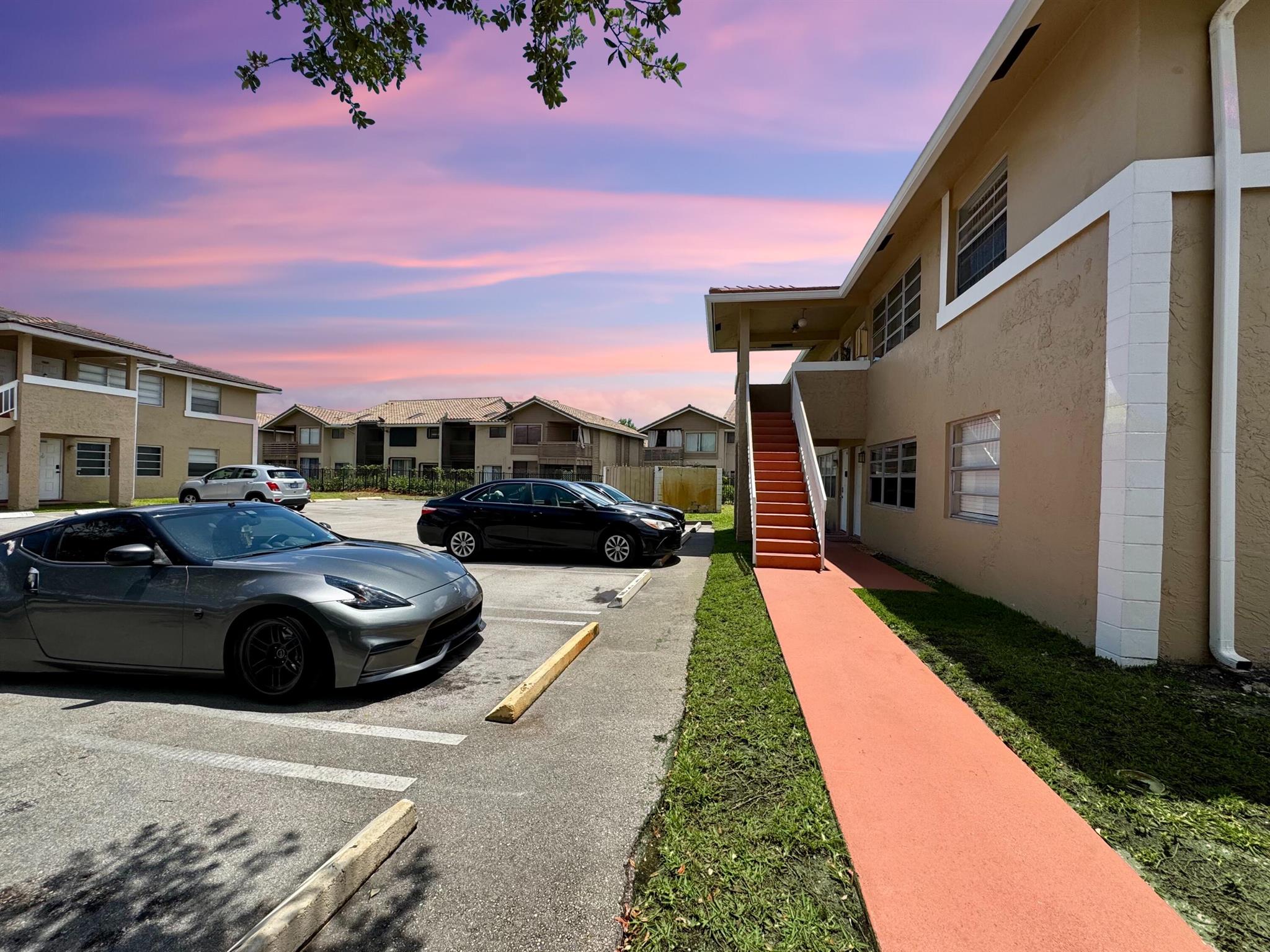 First-floor corner unit - water, sewer, and trash included in rent! Only First and Security Required To Move In! Beautifully updated 2-bed, 2-bath condo in Lakewood's Village, Coral Springs. This first-floor unit features a new A/C, quartz countertops, GE and Maytag stainless steel appliances--including over-the-range microwave, dishwasher, and MOEN garbage disposal. Kitchen includes modern fixtures and stainless steel cabinet hardware. Stylish tile flooring throughout, LED lighting, and a new water heater add efficiency. Bathrooms fully renovated with luxurious finishes. Minutes from Coral Square Mall, The Walk at University, top-rated schools, grocery stores, and major highways. Community pool, jogging paths, peaceful setting. One assigned parking space and ample guest parking.