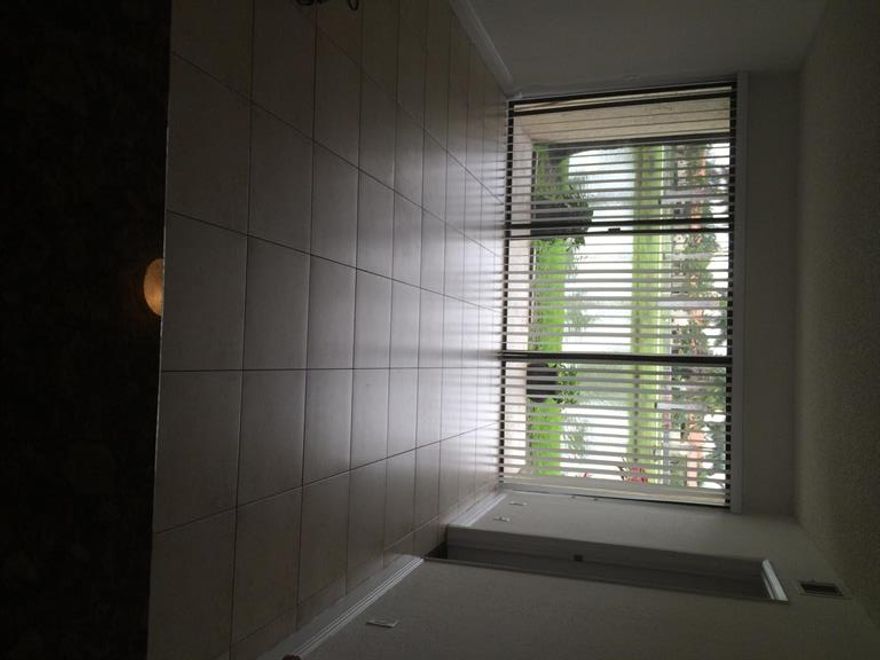 Perfect for investor or first time purchaser. First floor unit with an exceptional water views from the living room, one bedroom, and the covered porch. Granite counter tops throughout. Stainless steel appliances, built-in microwave, and an interior washer and dryer. Tile in main areas, carpet in bedrooms, fresh paint. Palm Beach Grande features low-maintenance living with great amenities including a clubhouse, swimming pools, tennis, and exercise room. The development is centrally located with easy access to I-95 and the Florida Turnpike. Includes Washer & Dryer. Association fee includes water. Large community club house and pool are located across Benoist Farms Road. There are several satellite pools, as well.