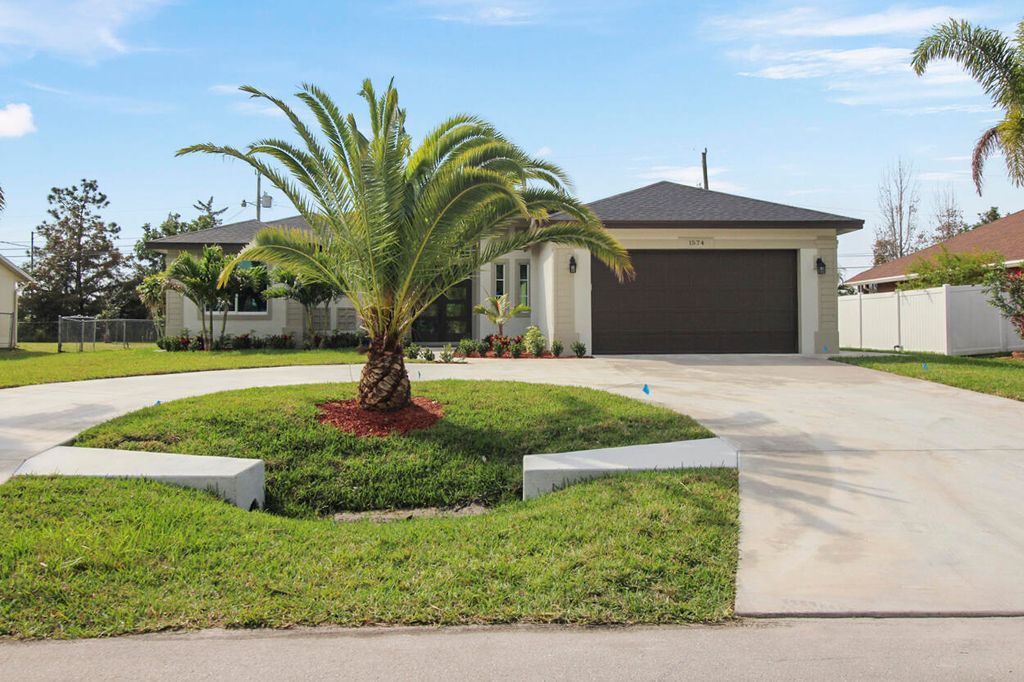 Photo of 1574 SW Calmar Avenue, Port Saint Lucie, FL 34953 (MLS # R10966675)