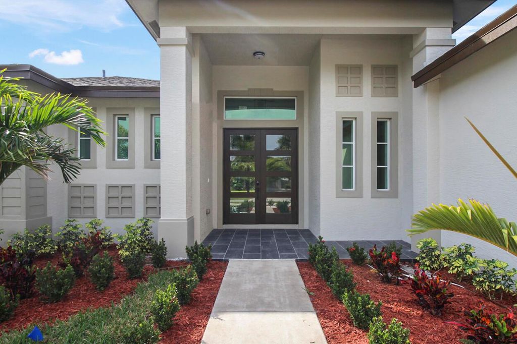 Photo of 1574 SW Calmar Avenue, Port Saint Lucie, FL 34953 (MLS # R10966675)