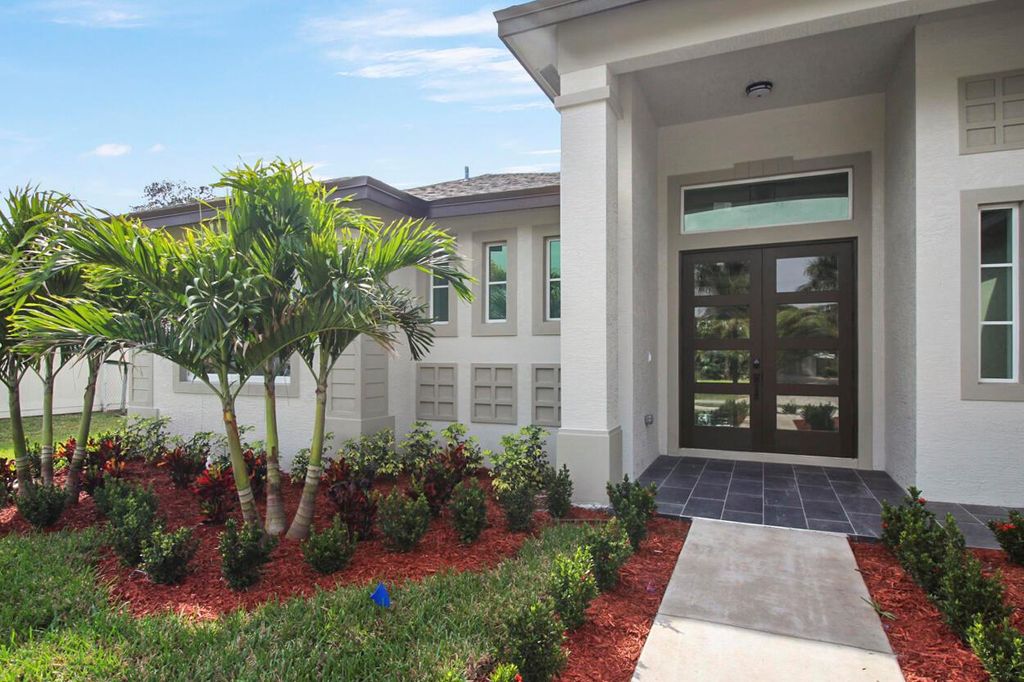 Photo of 1574 SW Calmar Avenue, Port Saint Lucie, FL 34953 (MLS # R10966675)