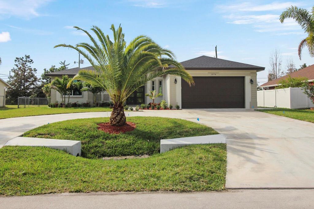 Photo of 1574 SW Calmar Avenue, Port Saint Lucie, FL 34953 (MLS # R10966675)