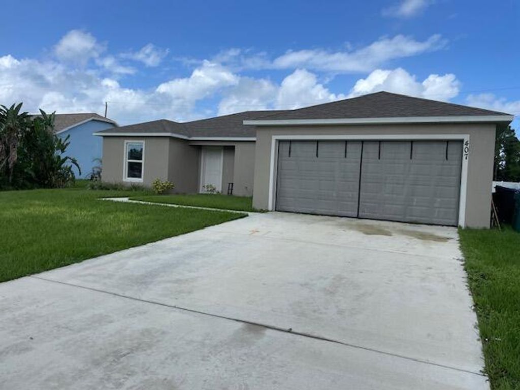 Photo of 407 SW Lacroix Avenue, Port Saint Lucie, FL 34953 (MLS # R10924107)