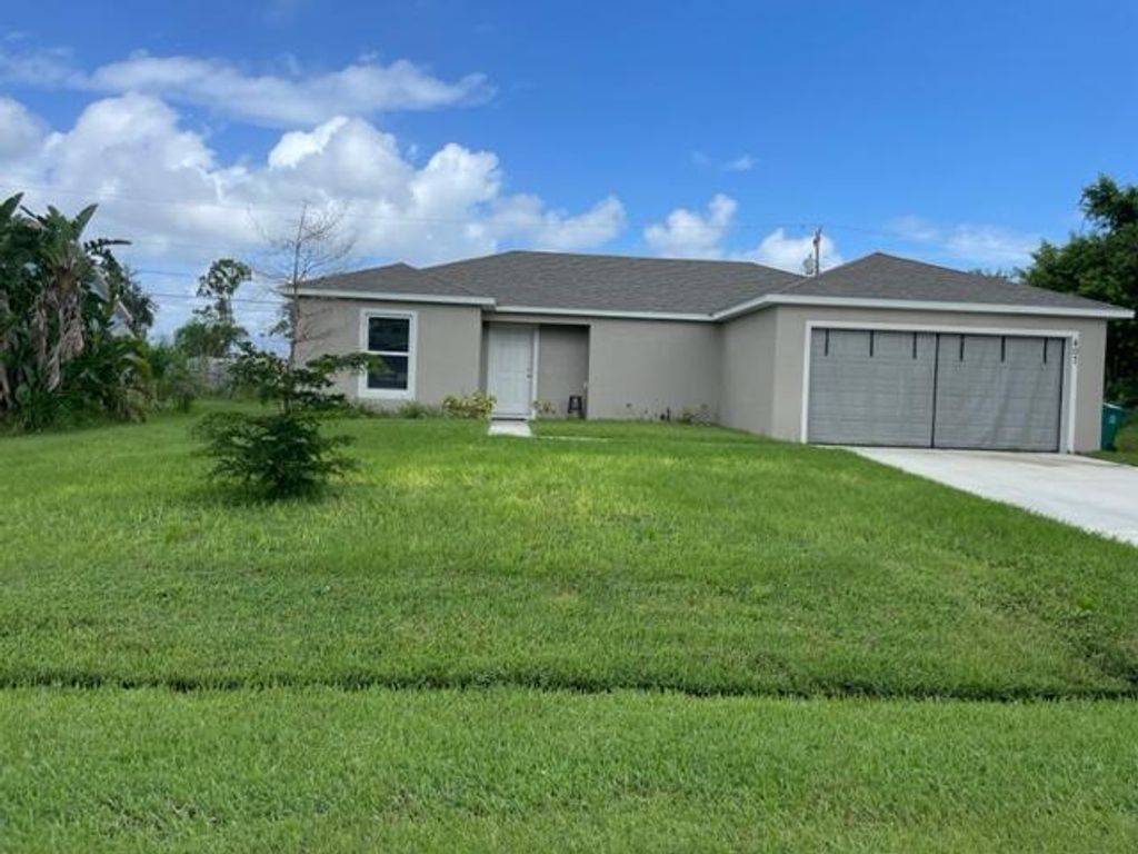 Photo of 407 SW Lacroix Avenue, Port Saint Lucie, FL 34953 (MLS # R10924107)