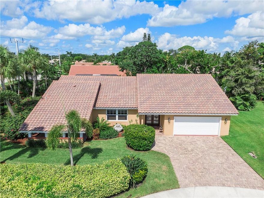 TROPICAL PARADISE awaits. FULLY UPDATED, POOL home features CUSTOM finishes throughout. IMPACT windows! Frosted glass, double door entry invites you to an OPEN CONCEPT living space adorned w/ CORAL flooring & 6" baseboards + crown molding. Spacious living & dining rooms for family gatherings. ENTERTAINING is a breeze in your gorgeous, CHEF's kitchen boasting center island! BRAND NEW LG reftrigerator. S/S upgraded applicances, full glass backsplash. BIG pantry w/ barn door entry! Family room enjoys soaring ceilings - ready for movie night. Relax in the owner's suite that opens to pool. Large bath has vessel sinks, frameless shower + stand alone tub. Split bedrooms for privacy! Guest BR has a 7X7 library! BR 3/offfice leads to heated pool & TRAVERTINE patio. LOW HOA! *NO EQUITY REQUIREMENT*