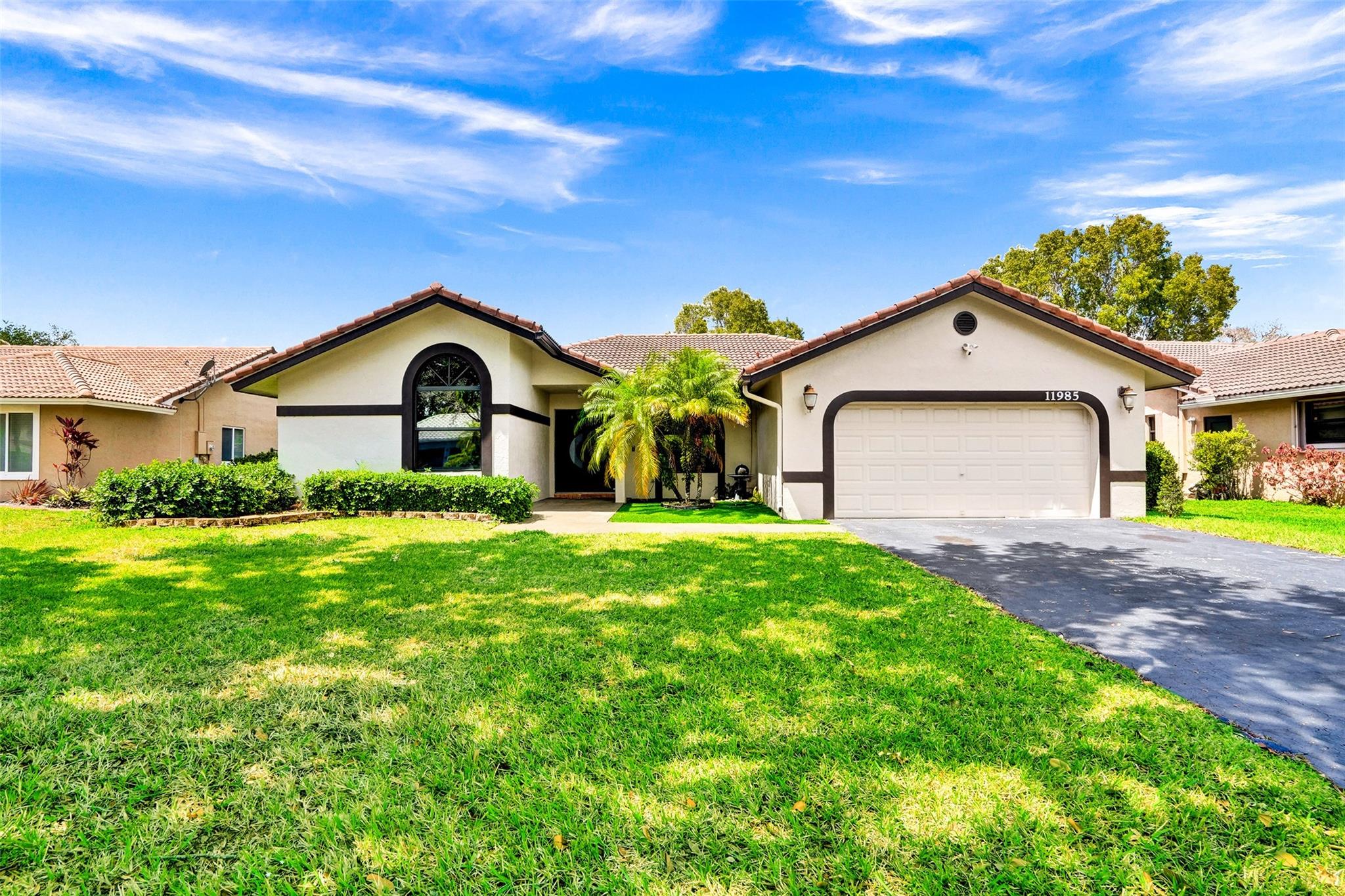 Beautiful 4-bedroom, 2.5-bath home located in the highly sought-after West Glen community! This stunning property offers soaring vaulted ceilings and an open floor plan that creates a bright, spacious feel throughout. The upgraded kitchen boasts granite countertops and quality cabinetry. Step outside to your private backyard oasis, featuring a newly resurfaced saltwater pool with a screened enclosure—perfect for relaxation or entertaining. Additional upgrades include accordion shutters throughout, impact-rated front doors, Wi-Fi-enabled light switches, a tankless water heater, and an electric vehicle charging outlet, all designed to enhance comfort, efficiency, and convenience