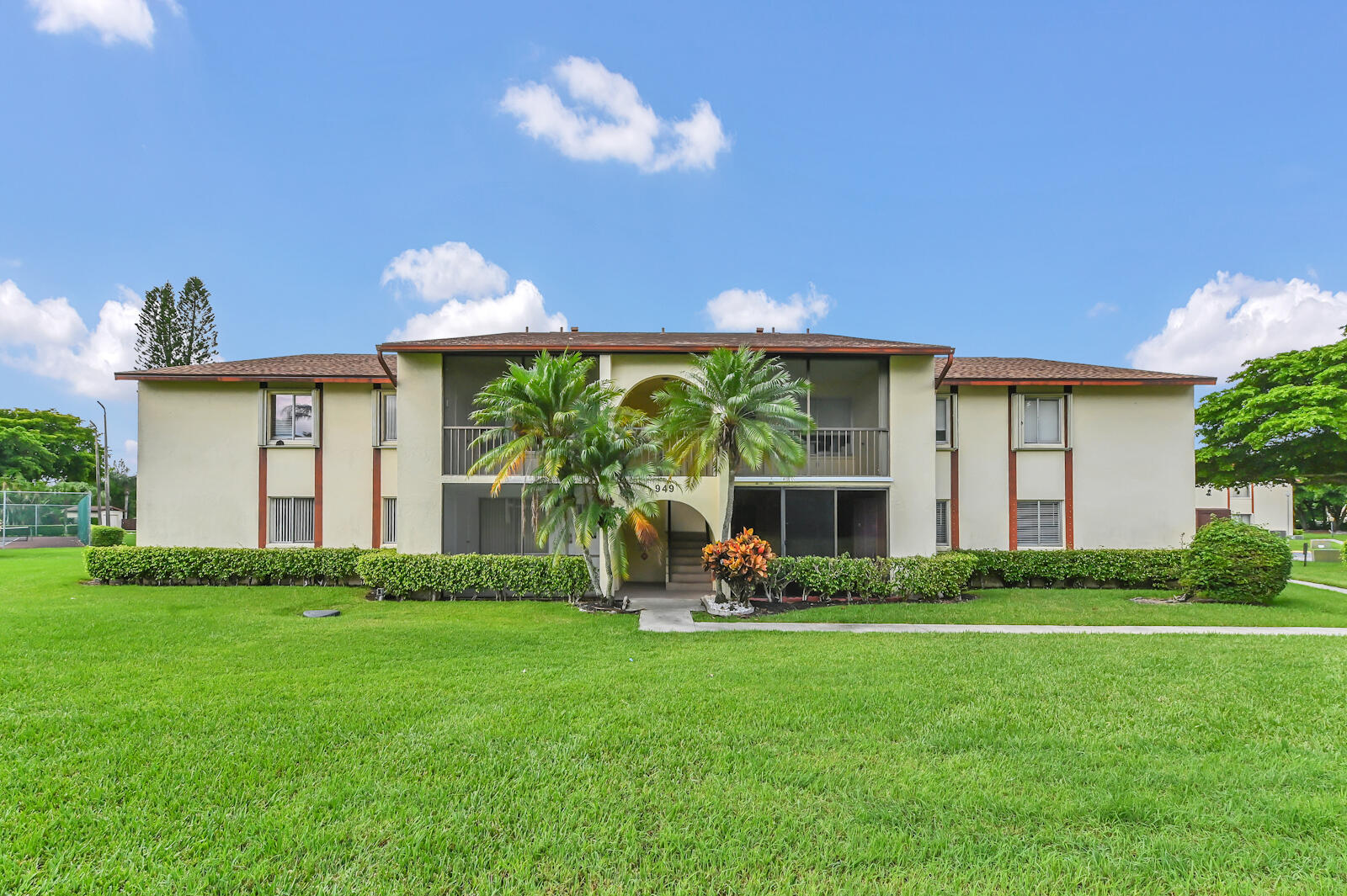 Welcome to this beautiful, partially updated 2-bedroom, 2-bathroom condo located in the desirable Pine Ridge at Haverhill community of West Palm Beach. This bright and spacious second-floor corner unit offers an inviting open-concept layout filled with natural light and garden views. Featuring new flooring, a new roof, and some new appliances, it blends comfort and charm. The kitchen features ample cabinetry, generous counter space, and some new appliances, while the open living and dining areas create a warm and welcoming atmosphere. Both bedrooms are well-sized with plentiful closet space, and the two full bathrooms provide convenience for family or guests. Residents enjoy access to a sparkling community pool, tennis courts, and scenic walking paths, all within a beautifully maintained