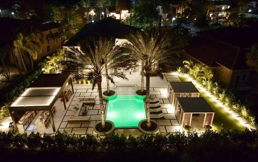 Discover unparalleled resort-style living in this fully redesigned, move-in-ready luxury estate, one of the most exceptional and turnkey properties available under $5M in Jupiter Country Club.
This architectural, magazine-worthy showpiece blends modern sophistication with timeless elegance, showcasing designer-selected finishes and a rare level of craftsmanship throughout.

Step inside to soaring ceilings, abundant natural light, and a stunning, custom chef's kitchen featuring quartz countertops and backsplash, premium Thermador appliances, Lynx outdoor culinary extensions, a built-in coffee system, and an oversized island perfect for entertaining. Every room reflects intentional design, elevated style, and a serene, high-end atmosphere. The expansive primary suite resides in its own private wing, offering tranquility, beautiful natural light, and a spa-inspired bathroom upgraded with refined finishes and exquisite details.
Additional features include:
Six Samsung frame TVs, custom artisan dry bar, upgraded spa-like bathrooms, brand new roof, updated HVAC systems, water softener with UV purification, backup gas generator, mesh Wi-Fi, smart-home technology & integrated camera system. 
This home is truly turnkey luxury, designed for effortless, elevated living with no expense spared. 

This spectacular backyard is one of the finest private outdoor living environments in Jupiter Country Club. Thoughtfully designed and curated, this outdoor resort features a breathtaking 40' designer pool, an oversized 11' sun shelf with white tile and stone/turf decking, a custom-built pergola with retractable sunshades, a chef-grade Lynx outdoor kitchen with quartzite waterfall countertops, hibachi grill, wine/beverage refrigerators & ice maker, two bespoke luxury cabanas with Samsung Frame TVs & Brazilian hardwood accents, an impressive 60' turf putting green framed by lush landscaping, layered custom lighting creating dramatic, resort-style evening ambiance. Perfect for entertaining, relaxing, and living the ultimate Florida luxury lifestyle. 

Jupiter Country Club is a premier, guard-gated community featuring a Greg Norman Signature golf course, resort pools, tennis, pickleball, fitness center, yoga studio, clubhouse dining, and 24/7 manned security with hourly roving patrols. Located moments from pristine beaches, luxury shopping, top-rated schools, world-class dining, I-95, the Florida Turnpike, and PBI airport.