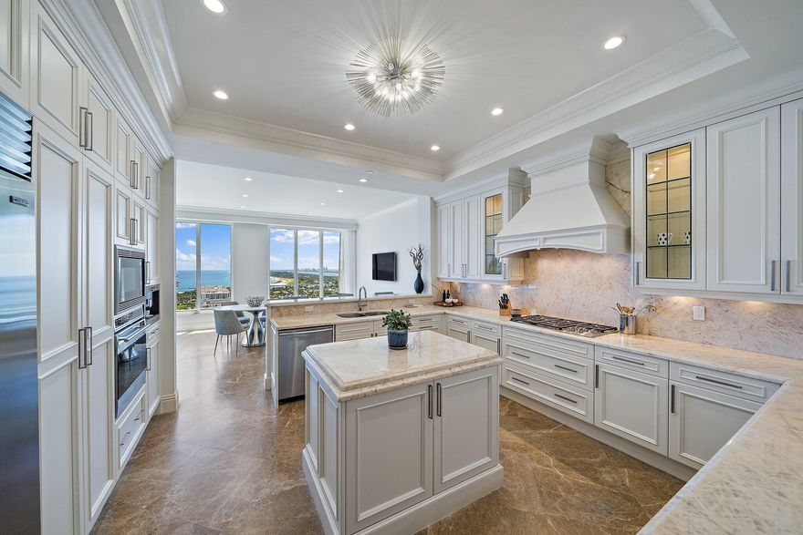 Steps from the beach, this Lower Penthouse Ritz Carlton Residence is beautifully renovated, with 2 private balconies, den/bonus room and wet bar. Chef's kitchen with Sub Zero, Miele and Wolf appliances and Quartzite countertops. Elevator opens directly into your Condo unit with 5 star amenities including 2 pools, a private beach, 2 full gyms with sauna, valet, auto detailing, and private theater. Best of all, this is one of only three condo properties on Singer Island that has its own private restaurant with poolside service. This unit includes 2 reserved parking spots in the garage under the building, and a downstairs storage unit.. * ALL REALTORS MUST READ THE BROKER REMARKS