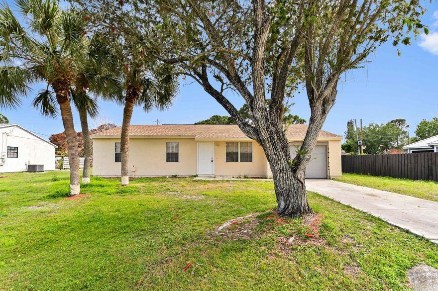 Step into this beautifully updated 3-bedroom, 2-bath home nestled in the heart of Southeast Port St. Lucie, where comfort and style come together effortlessly. From the moment you enter, you'll appreciate the bright, open layout enhanced by sleek tile flooring throughout and a thoughtfully renovated kitchen featuring modern cabinetry, quartz countertops, and stainless-steel appliances. The living and dining areas flow seamlessly, creating an inviting space perfect for everyday living or entertaining guests, while the updated bathrooms add a fresh, contemporary touch. Situated on a generous lot in a quiet, established neighborhood, this move-in ready home offers both privacy and convenience. Enjoy easy access to nearby shopping, dining, and outdoor recreation, with scenic trails and nature preserves just moments away. With its ideal location, stylish upgrades, and comfortable single-story design, this home is perfect for those seeking a relaxed Florida lifestyle with everything you need close at hand.